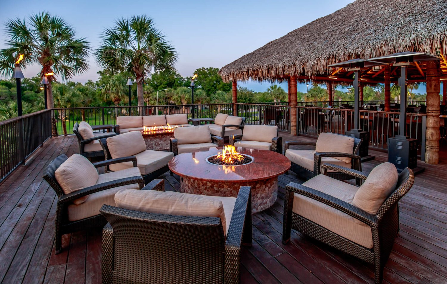 Outdoor fire pit lounge at the Tiki Bar at sunset